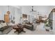 Spacious open-plan living area featuring modern lighting, neutral paint, and seamless flow to the kitchen and dining at 5438 E Lupine Ave, Scottsdale, AZ 85254