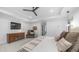 Bright main bedroom boasts tray ceilings, a ceiling fan, and a TV mounted on a wall at 5438 E Lupine Ave, Scottsdale, AZ 85254
