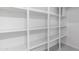 Organized storage with white shelving and bright lighting at 5438 E Lupine Ave, Scottsdale, AZ 85254