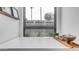 Elegant bathtub with stylish faucet hardware, view of backyard, and decor at 5438 E Lupine Ave, Scottsdale, AZ 85254