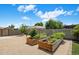 Spacious backyard features raised garden beds and ample space for outdoor activities or gardening at 5926 E Hartford Ave, Scottsdale, AZ 85254