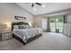 Spacious main bedroom with vaulted ceiling, slider to backyard, and neutral decor at 5926 E Hartford Ave, Scottsdale, AZ 85254