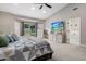 Large main bedroom featuring a walkout, neutral carpeting, ceiling fan, and ensuite bathroom at 5926 E Hartford Ave, Scottsdale, AZ 85254