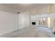 Open living room featuring a fireplace and sliding glass doors to patio at 6 E Manzanita Dr, Phoenix, AZ 85020