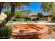 Inviting community pool and fire pit area with ample seating for residents to relax and enjoy the Arizona sunshine at 6 E Manzanita Dr, Phoenix, AZ 85020