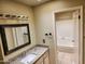 Bathroom featuring granite vanity and a shower/tub combination at 603 S Allred Dr, Tempe, AZ 85281