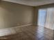 This bedroom features neutral walls, tile flooring and a window with vertical blinds at 603 S Allred Dr, Tempe, AZ 85281
