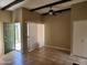 Cozy living room features a ceiling fan, exposed beams and stylish tiled flooring at 603 S Allred Dr, Tempe, AZ 85281