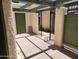 Enclosed patio featuring a gated entrance, olive green door, and rustic-style beamed overhang at 603 S Allred Dr, Tempe, AZ 85281