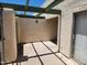 Covered patio with a stucco wall, beam overhang, and sliding glass door at 603 S Allred Dr, Tempe, AZ 85281