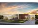 Stunning modern home featuring mixed materials and lush landscaping at 6145 E Gold Dust Ave, Paradise Valley, AZ 85253