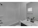 Bright bathroom with tub and shower combo, vanity with countertop and large mirror at 6434 N 17Th St, Phoenix, AZ 85016