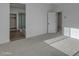 Minimalist bedroom with a glimpse of a bathroom featuring glass shower doors at 6434 N 17Th St, Phoenix, AZ 85016