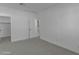 Bright bedroom featuring neutral carpeting and adjacent closet at 6434 N 17Th St, Phoenix, AZ 85016