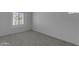 Bright bedroom featuring neutral carpeting and a window that provides natural light at 6434 N 17Th St, Phoenix, AZ 85016