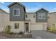 Well-maintained two-story home exhibiting neutral stucco, complementary grey siding, and a spacious two-car garage at 6434 N 17Th St, Phoenix, AZ 85016