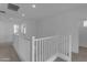 Upstairs hallway featuring white railings and lots of natural light at 6434 N 17Th St, Phoenix, AZ 85016