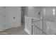 Bright hallway featuring a staircase and white painted doors and railings at 6434 N 17Th St, Phoenix, AZ 85016