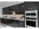 Gourmet kitchen with white quartz countertops, stainless appliances, and modern cabinetry at 6434 N 17Th St, Phoenix, AZ 85016