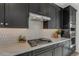Gourmet kitchen featuring quartz countertops, stainless appliances, and modern cabinetry at 6434 N 17Th St, Phoenix, AZ 85016