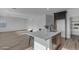 Bright kitchen with quartz island featuring stainless appliances, and eat-in counter at 6434 N 17Th St, Phoenix, AZ 85016