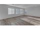 Bright and airy living room with wood-look tile flooring and natural light at 6434 N 17Th St, Phoenix, AZ 85016