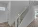 Bright staircase with white railings and carpeted steps, offering a clean and modern design at 6434 N 17Th St, Phoenix, AZ 85016