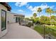 Overhead view of a large outdoor balcony with wrought iron railing and greenery at 6611 N 64Th Pl, Paradise Valley, AZ 85253
