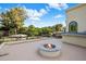 Outdoor balcony featuring a built-in fire pit, mountain views, and desert landscape at 6611 N 64Th Pl, Paradise Valley, AZ 85253