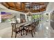 Formal dining room boasts a coffered wood ceiling, chandelier, and large windows at 6611 N 64Th Pl, Paradise Valley, AZ 85253