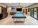 Game room featuring a pool table, comfortable seating, and natural light at 6611 N 64Th Pl, Paradise Valley, AZ 85253