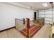Spacious garage with a mechanical lift, and an automatic door with natural light, plus a light-colored vehicle at 6611 N 64Th Pl, Paradise Valley, AZ 85253