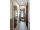 Hallway showcasing a tiled accent border leading to a glass-enclosed shower at 6611 N 64Th Pl, Paradise Valley, AZ 85253