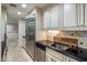 Kitchen area featuring stainless steel appliances, tile backsplash, and ample cabinetry at 6611 N 64Th Pl, Paradise Valley, AZ 85253