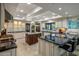 Gourmet kitchen with large islands, custom cabinets, high-end appliances, and granite countertops at 6611 N 64Th Pl, Paradise Valley, AZ 85253