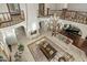 Spacious living room showcasing a fireplace, chandelier, balcony views, and comfortable seating at 6611 N 64Th Pl, Paradise Valley, AZ 85253