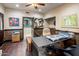 Office space with two-tone walls, tile floors, modern decor, and a door leading to an adjacent bathroom at 6611 N 64Th Pl, Paradise Valley, AZ 85253