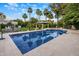 Beautiful backyard pool with palm trees, lounge chairs, and a serene atmosphere, perfect for relaxation at 6611 N 64Th Pl, Paradise Valley, AZ 85253