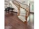 Staircase with hardwood flooring, carpeted steps, and decorative wood trim, leading to upper levels of the residence at 6611 N 64Th Pl, Paradise Valley, AZ 85253