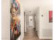 Hallway with neutral walls and flooring showcasing artwork on the wall at 7604 N 46Th Ave, Glendale, AZ 85301