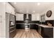 Modern kitchen boasts stainless steel appliances, granite countertops, and ample cabinet space at 7604 N 46Th Ave, Glendale, AZ 85301