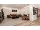 Spacious living room featuring brick accent wall and tile floors at 7604 N 46Th Ave, Glendale, AZ 85301
