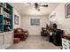 Well-lit office space with custom shelving and tile floors at 7604 N 46Th Ave, Glendale, AZ 85301
