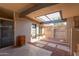 Relaxing covered patio featuring stylish pavers, rock landscaping and outdoor lighting at 7604 N 46Th Ave, Glendale, AZ 85301