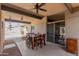 Covered patio includes ceiling fan, dining table, and views of the backyard and pool area at 7604 N 46Th Ave, Glendale, AZ 85301