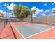Outdoor basketball and pickleball court surrounded by fencing and trees, offering a recreational space within the community at 7807 E Main St # Cc-71, Mesa, AZ 85207