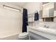Bathroom features a shower/tub combo and sink with rustic shelving above the toilet at 7807 E Main St # Cc-71, Mesa, AZ 85207