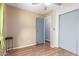 Bedroom featuring neutral walls, ceiling fan, closet, and an en-suite bathroom entrance at 7807 E Main St # Cc-71, Mesa, AZ 85207