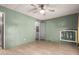 Bedroom with light green walls, closet, and view of en suite bathroom at 7807 E Main St # Cc-71, Mesa, AZ 85207