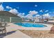 Sparkling community pool with clear blue water, surrounded by a fenced area for safety, providing a refreshing amenity at 7807 E Main St # Cc-71, Mesa, AZ 85207